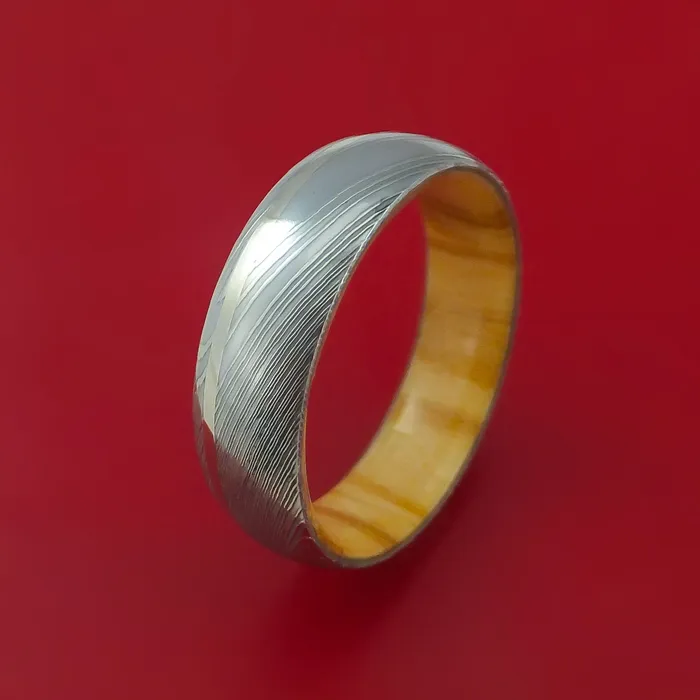 Damascus Steel Ring with 14K White Gold Inlay and Interior Hardwood Sleeve Custom Made Band Lashbrook Rings Damascus Steel Ring with 14K White Gold Inlay and Interior Hardwood Sleeve Custom Made Band Lashbrook Rings